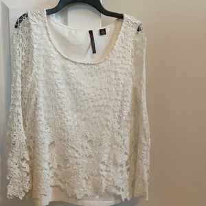 Cream top with lace overlay and lace sleeves. Excellent condition